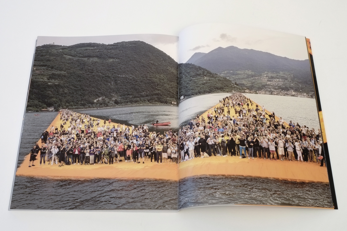 Idolatry moments - visitors taking pictures of the barge from which the artist, during one of his numerous daily tours, greets them. Christo & Jeanne-Claude - The Floating Piers - 2014-2016, pp. 120-121
